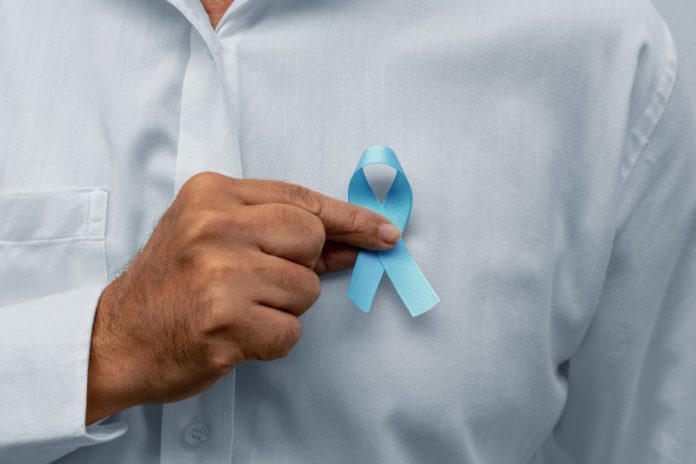 Blue november - man holding blue ribbon